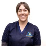 Vet nurse in blue scrubs